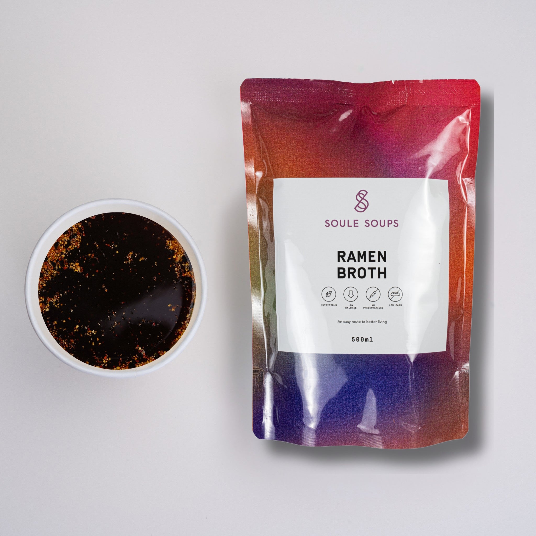 Soule Soups Ramen Broth package with a bowl of broth on a light gray background
