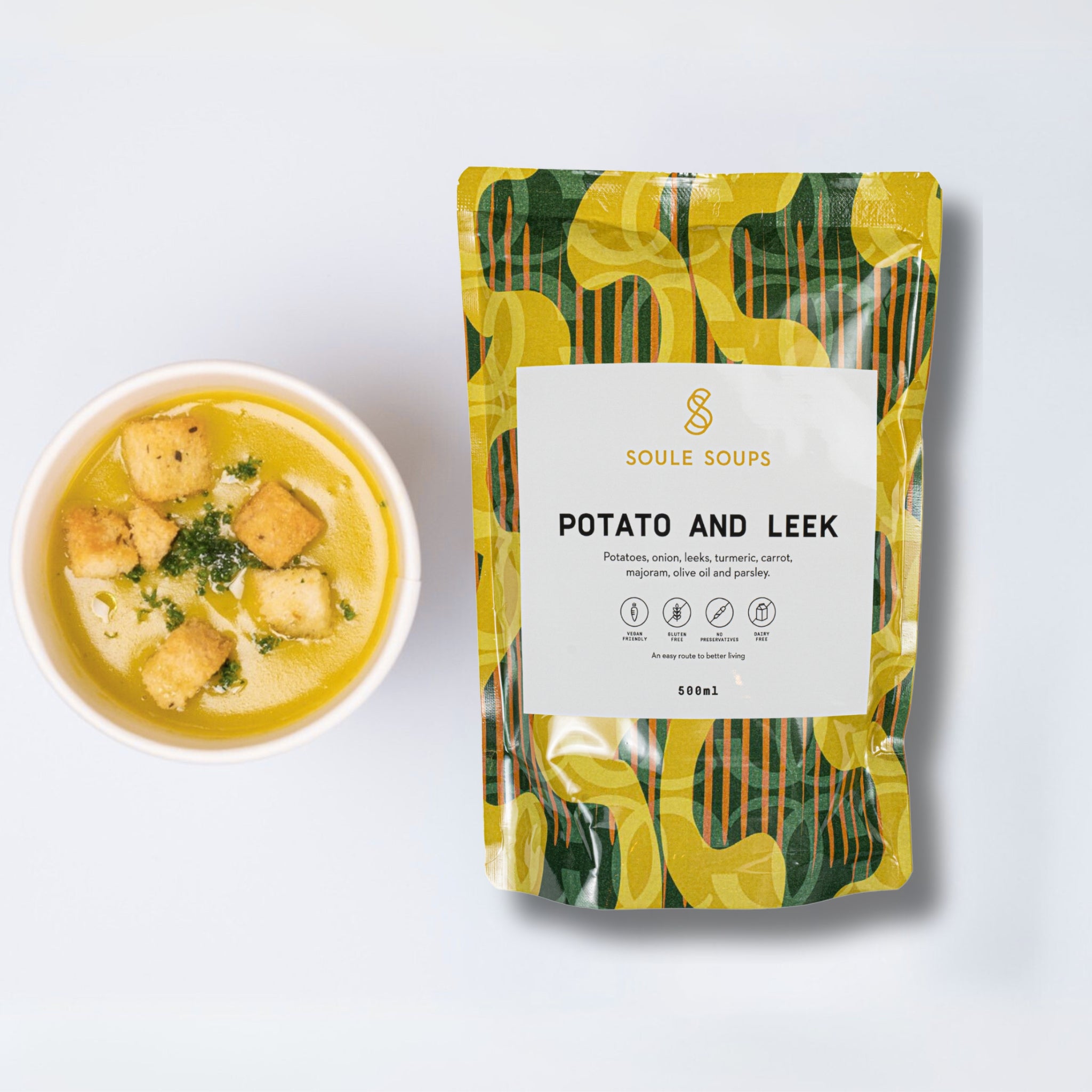 Soule Soups Packaged soup with a bowl of potato and leek soup on a light background