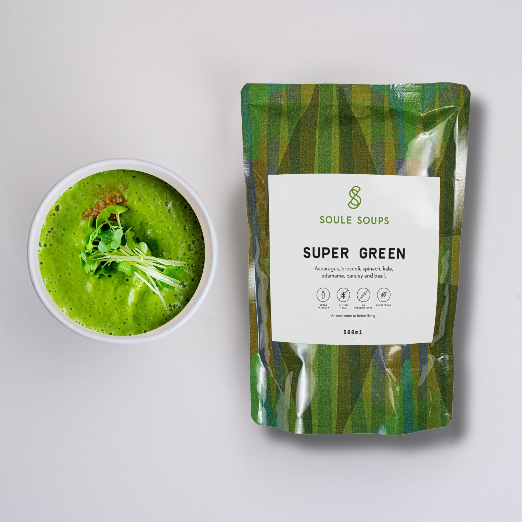 Soule Soups Super Green soup in a bowl with a 'Soule Soups Super Green' package on a light gray background